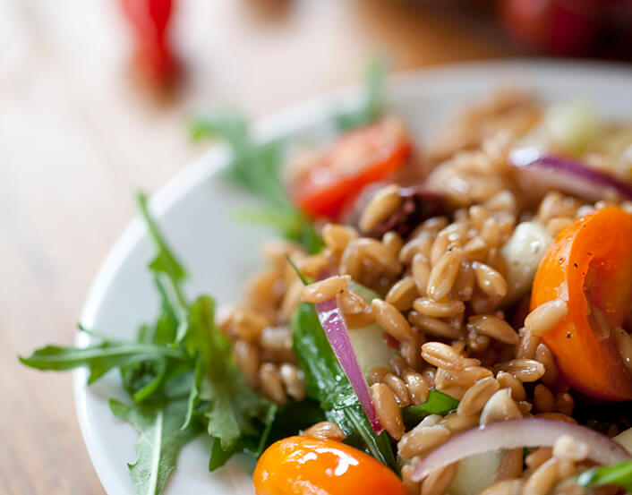 FARRO SALAD WITH CHERRY TOMATO, RED ONION, CUCUMBER & ARUGULA